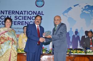 Prof. Dr. Habib Ur Rehman Presenting a Shield to Prof. Dr. Syed Zahoor Hassan